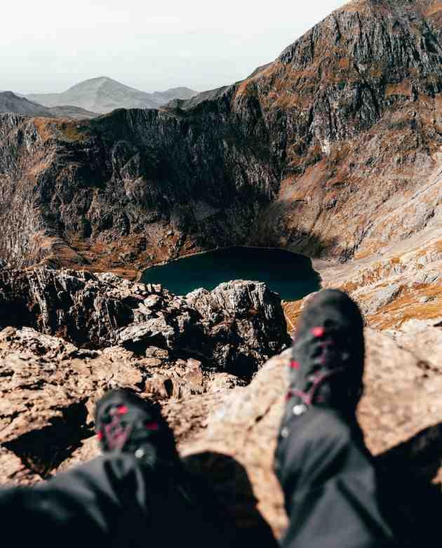 A car driving down a beautiful, winding scenic highway.